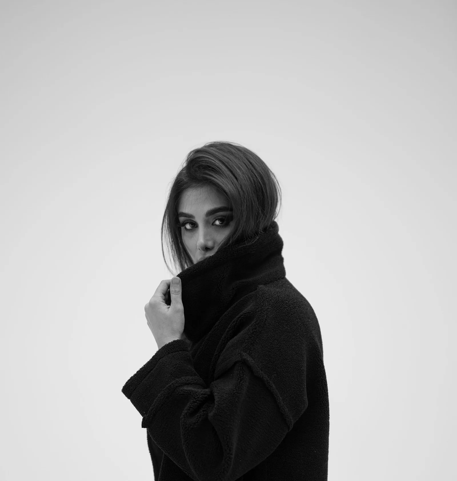 A model in a dark wool coat