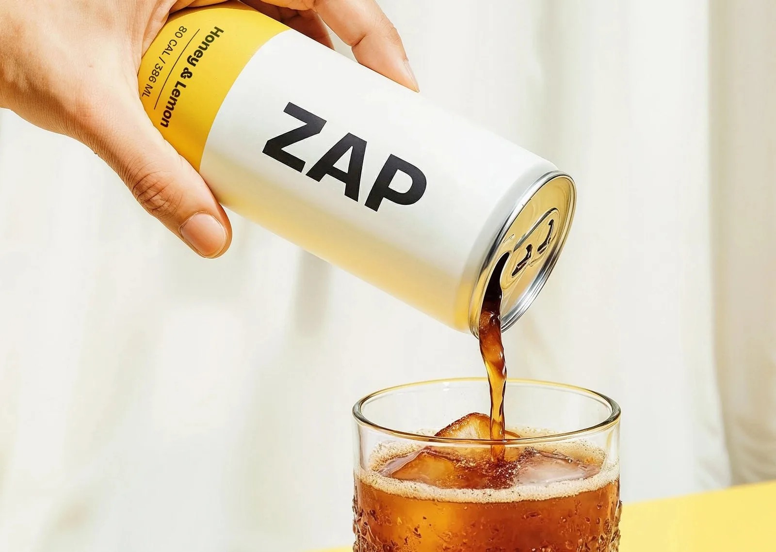 A can of cold brew poured over ice
