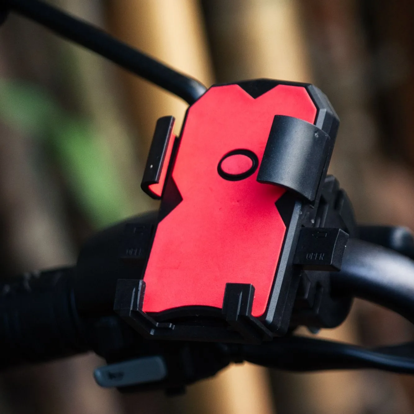 Red phone mount on a handlebar