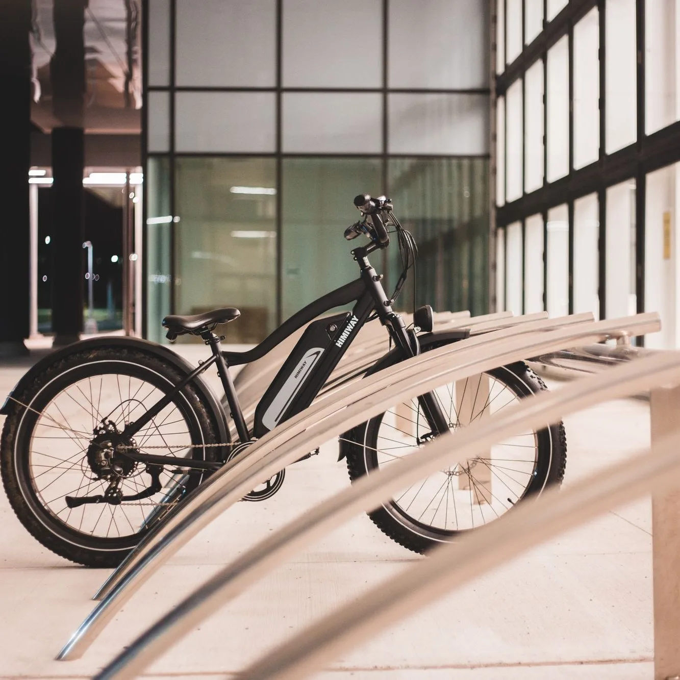 Black e-bike with wide tyres, side view