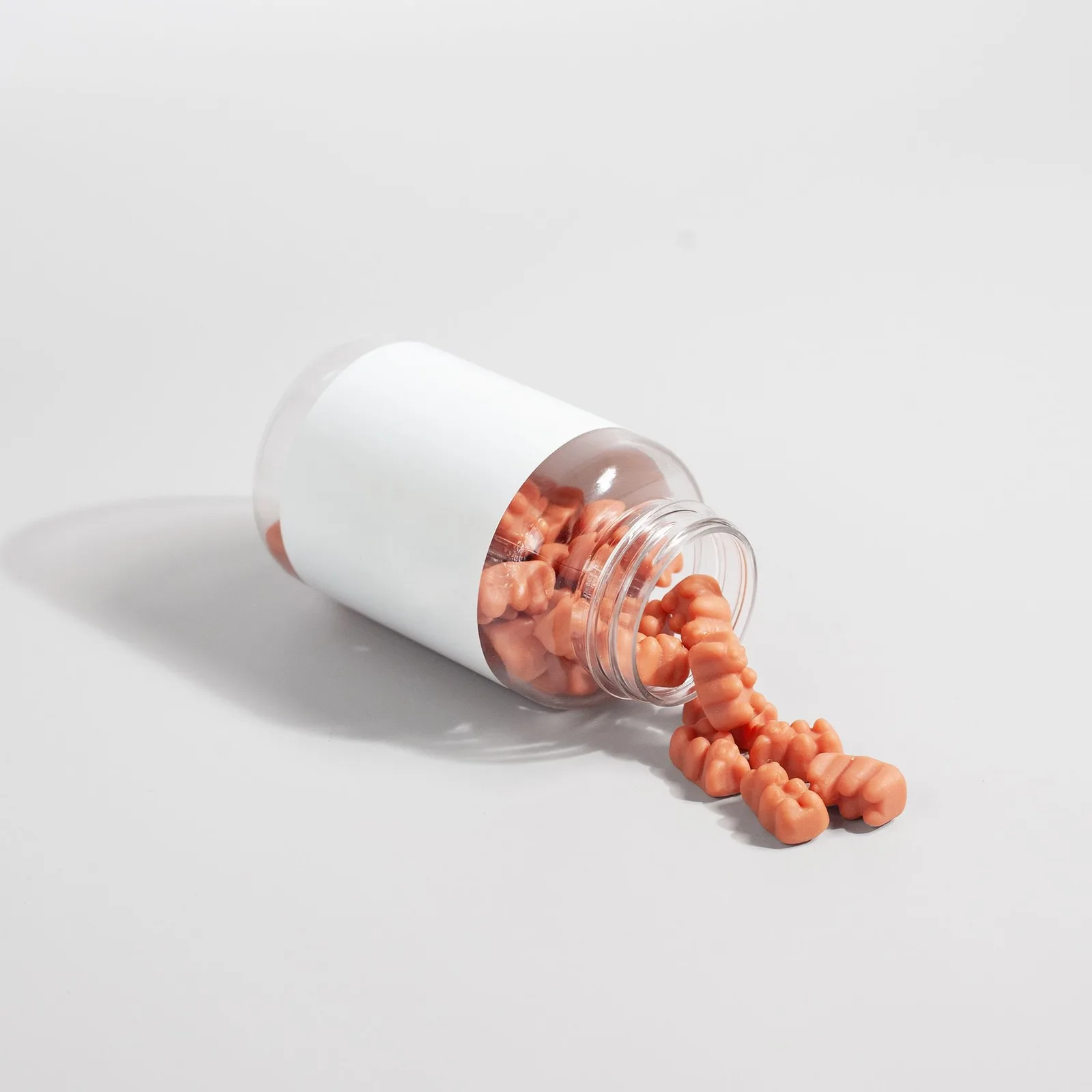 Gummies spilled from a jar