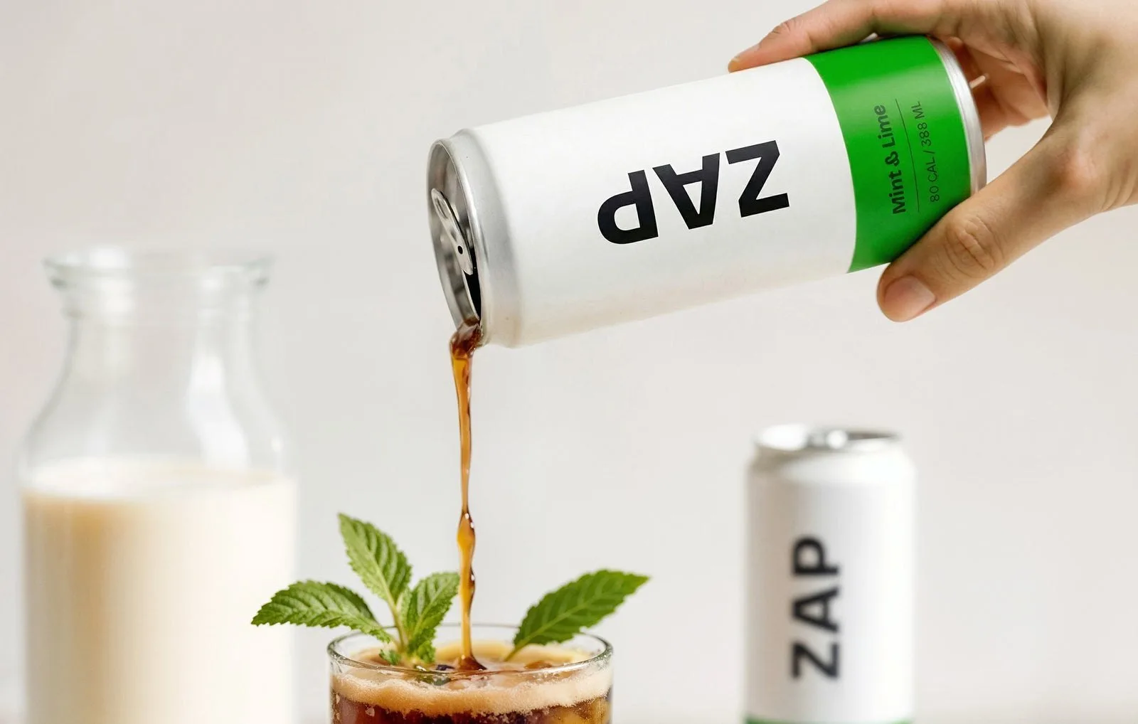 Cold brew poured from a can over ice