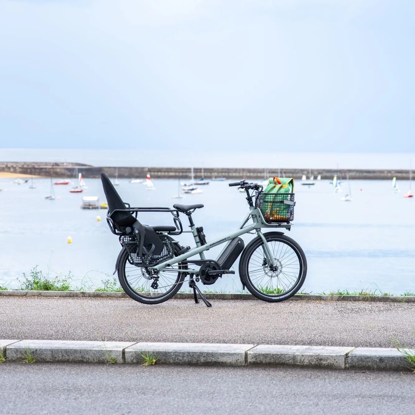 Grey long-tail e-bike by the sea