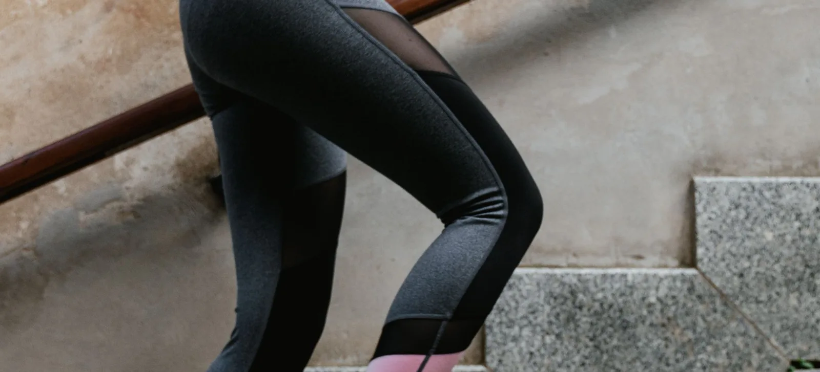 Legs in black shorts mid-stride