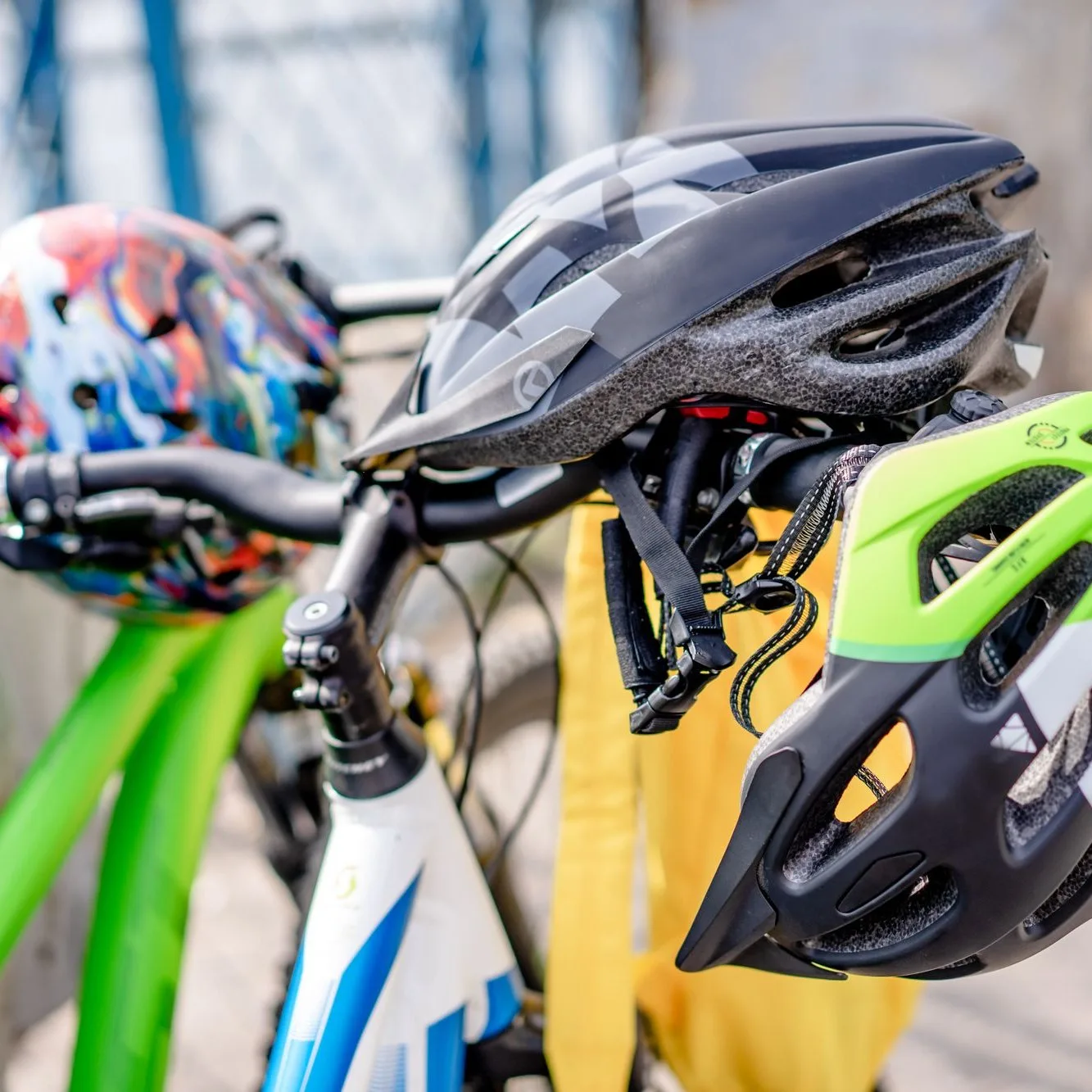Helmets resting on handlebars