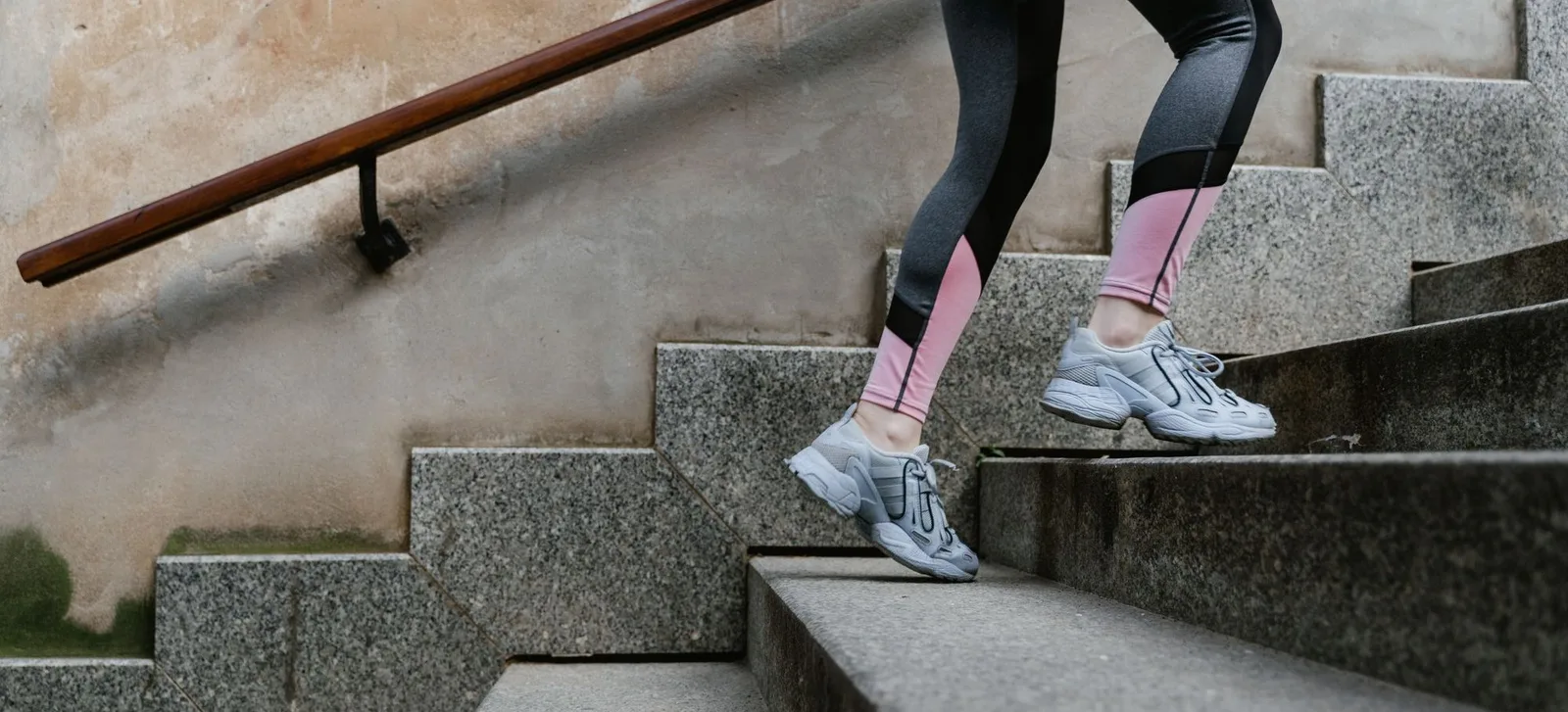 A runner on concrete stairs