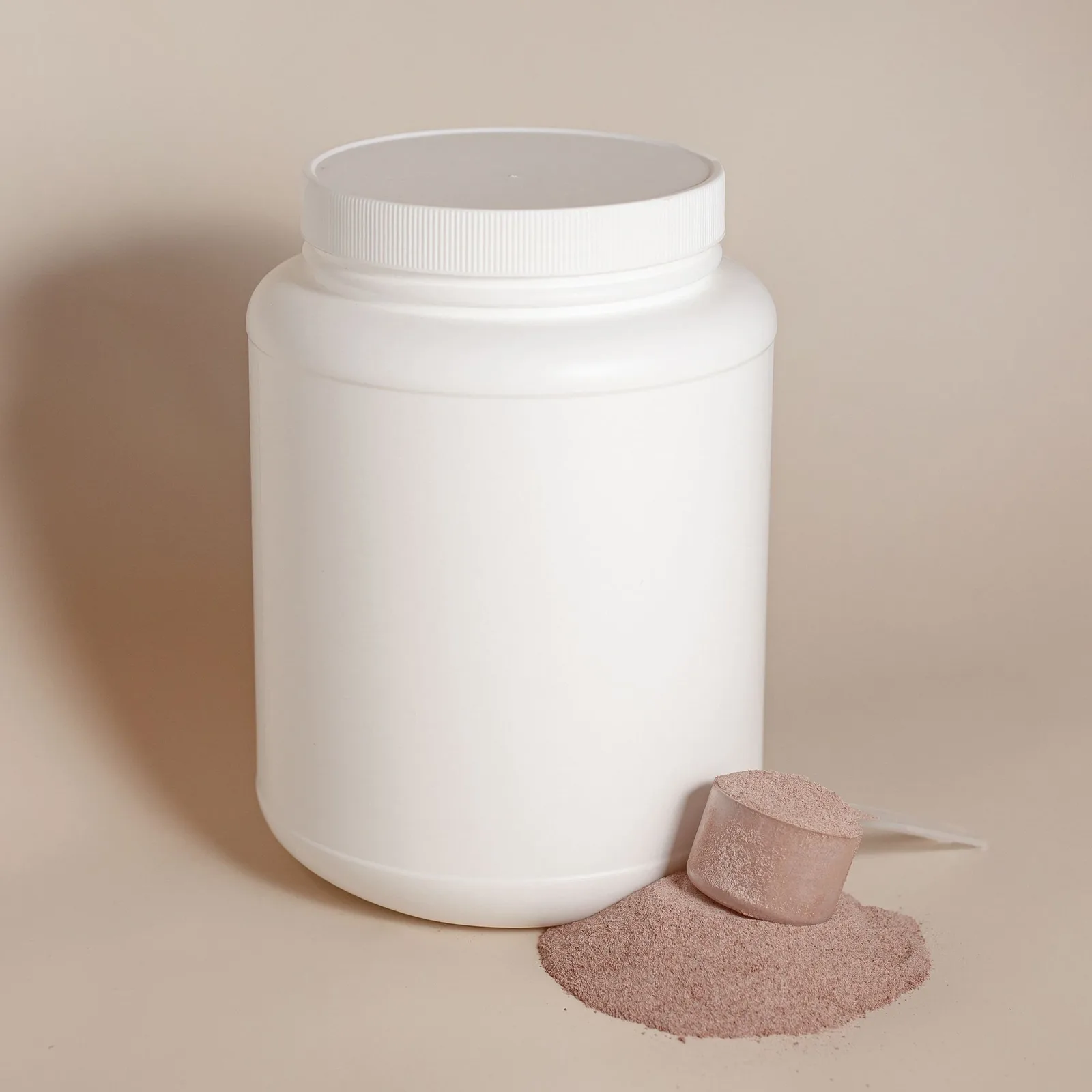 White tub with powder and a scoop