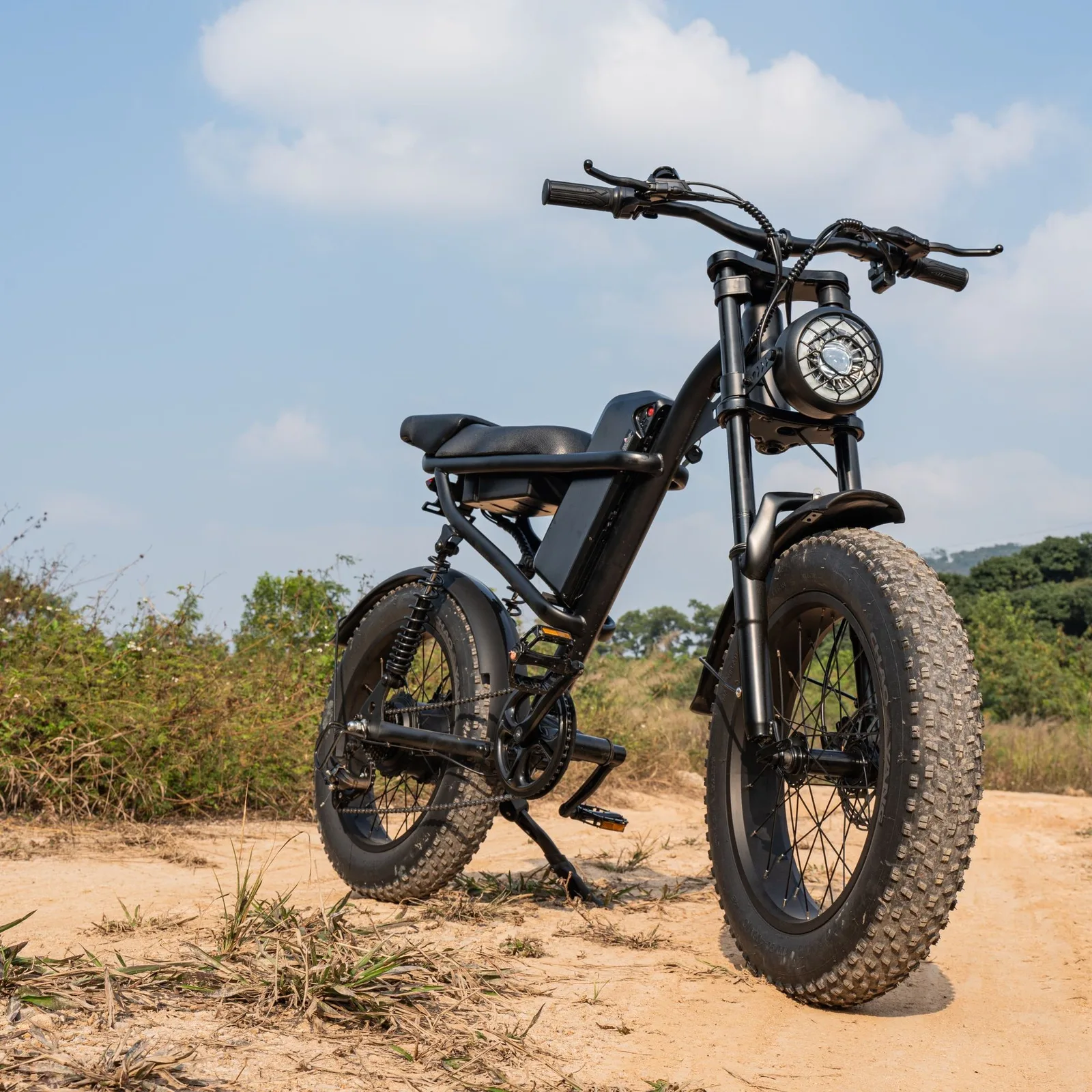 Black fat tyre e-bike on a sandy trail