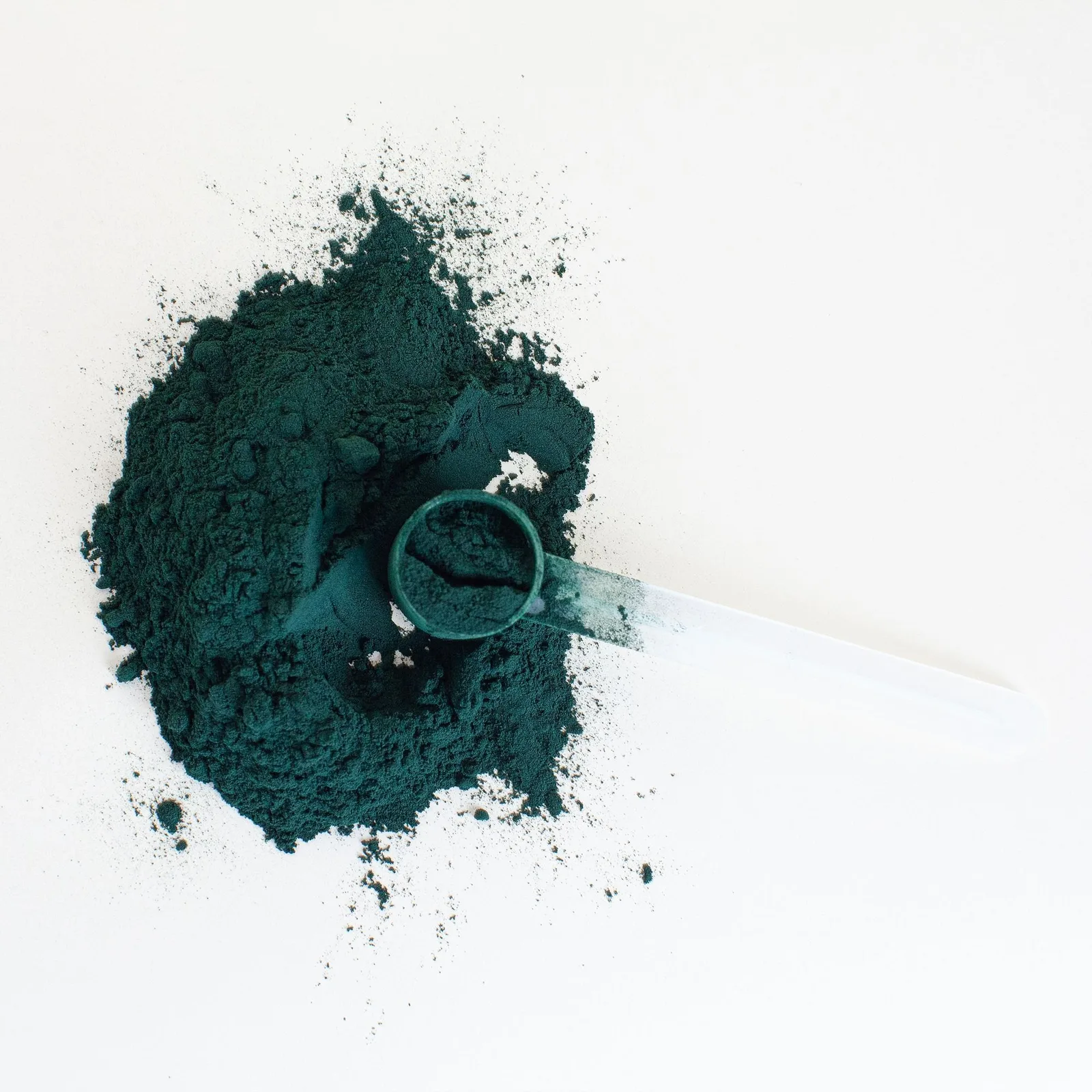 Green powder with a scoop