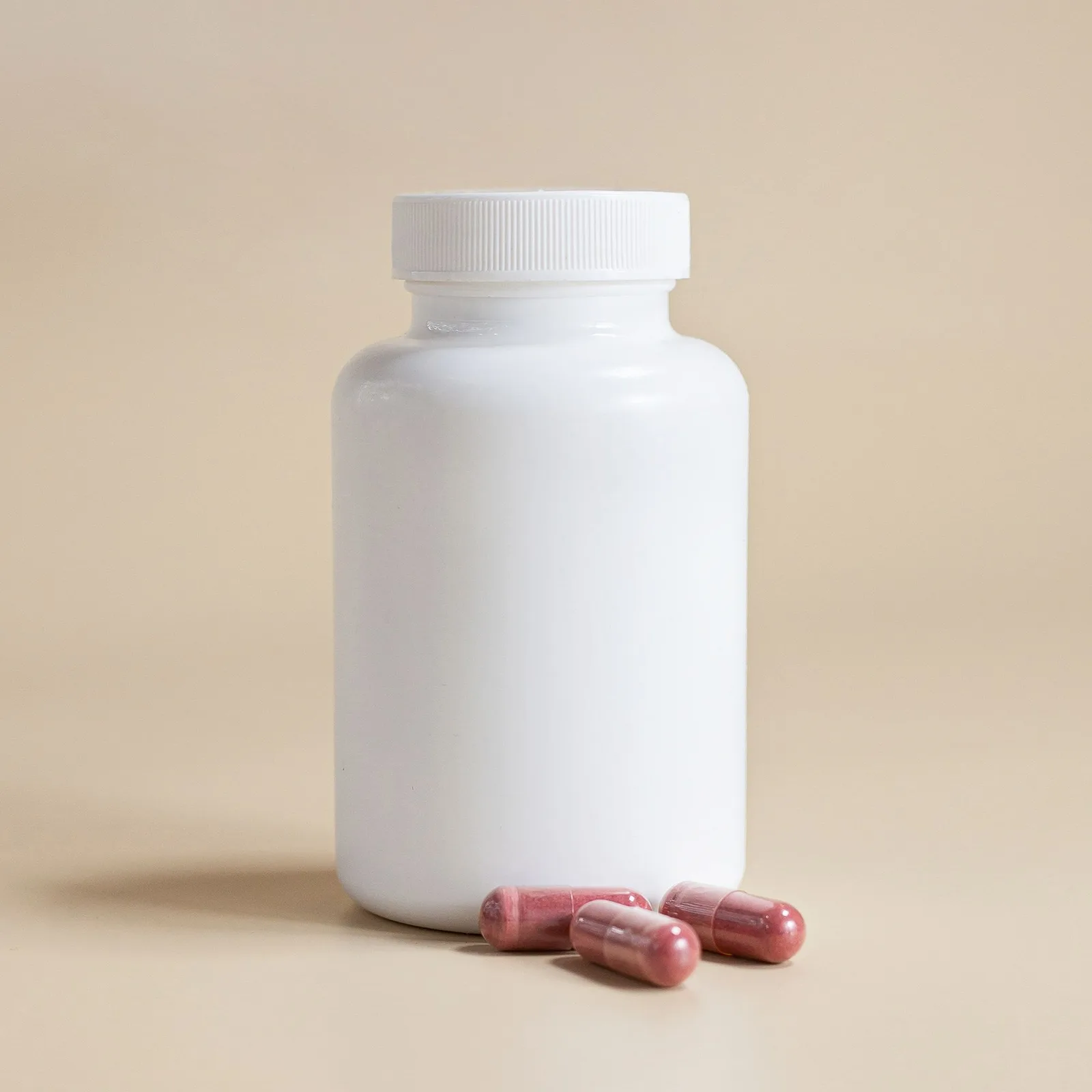 White bottle with capsules