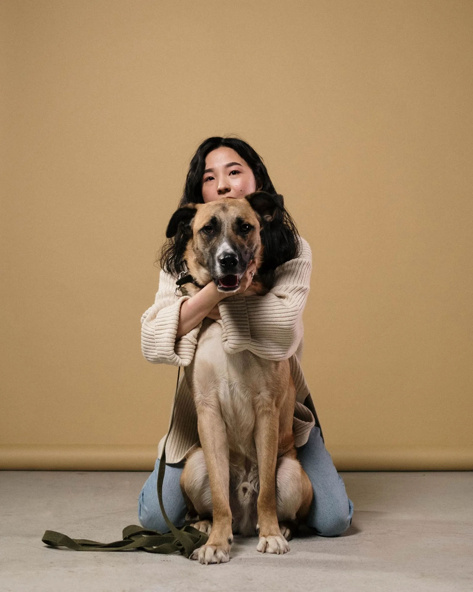 A woman hugging her dog