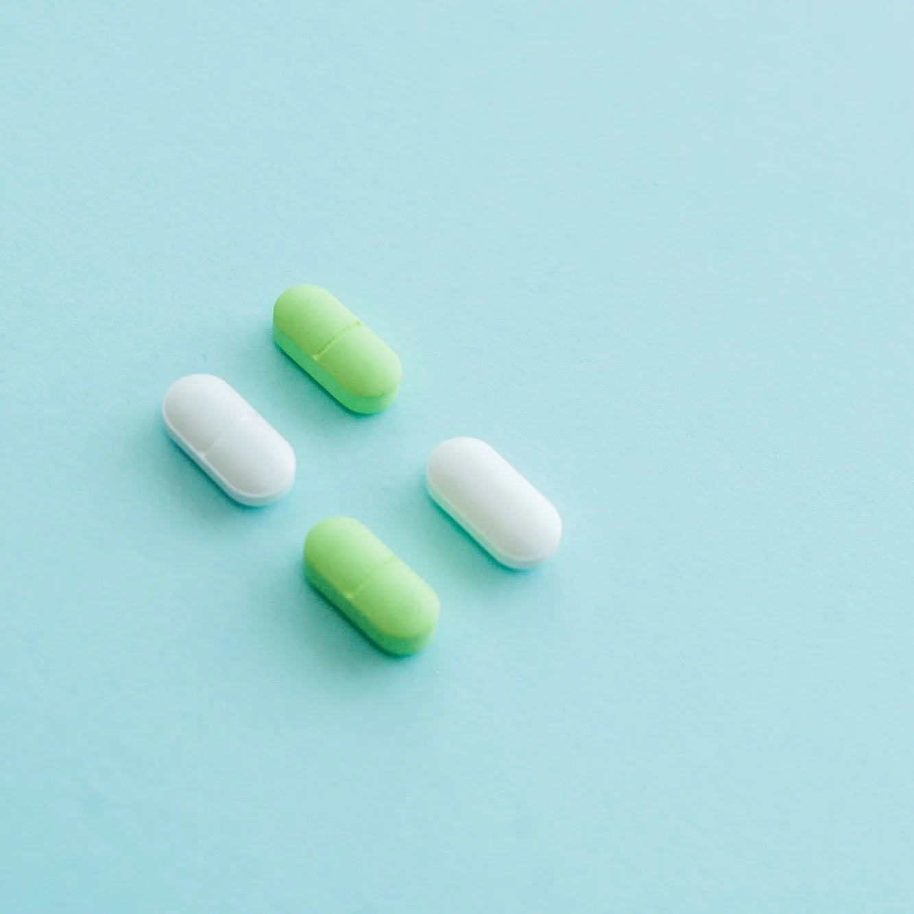 Capsules on pale blue